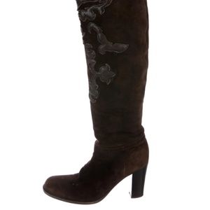 Brown Prada knee high boots.